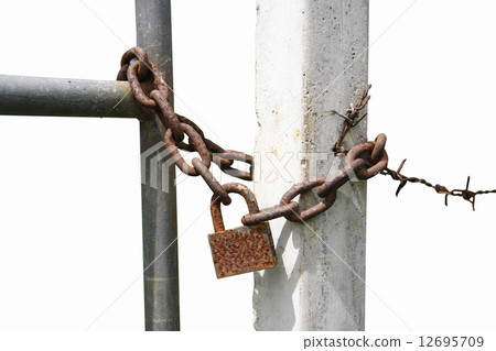 padlock with an iron chain at fence padlock with an iron chain at fence 12695709