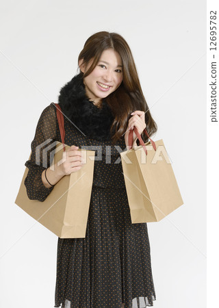 A young woman with plenty of shopping bags A young woman with plenty of shopping bags 12695782