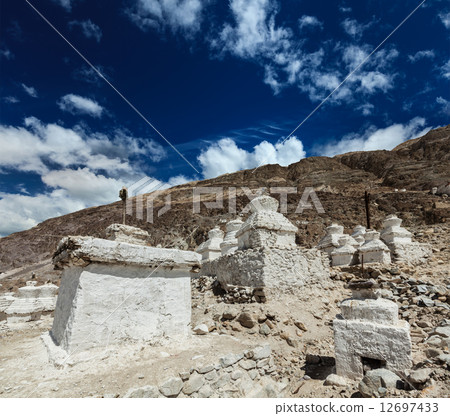 Chortens (Tibetan Buddhism stupas) in Himalayas. Nubra valley, L 12697433