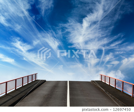 Asphalt road going into sky with clouds 12697450