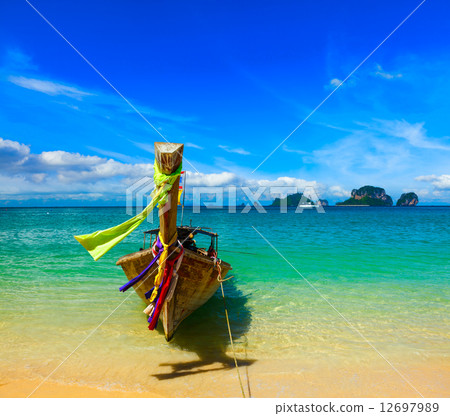 Long tail boat on beach, Thailand 12697989