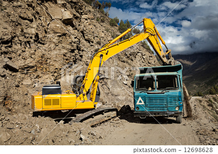 Road construction in mountains Himalayas 12698628