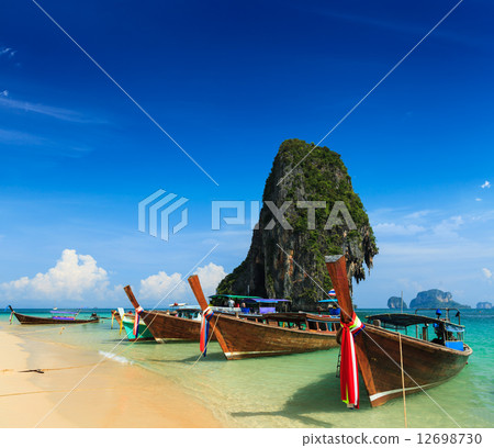Long tail boat on beach, Thailand 12698730