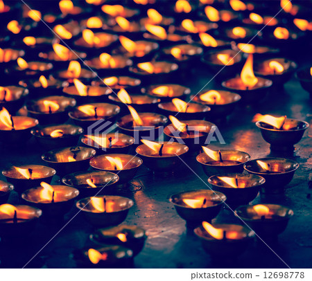 Burning candles in Buddhist temple, McLeod Ganj 12698778