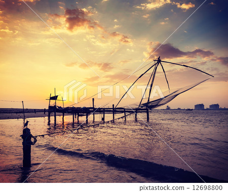 Chinese fishnets on sunset. Kochi, Kerala, India 12698800