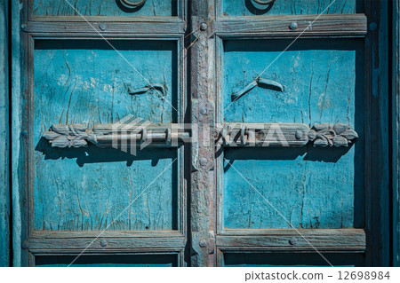 Latch with padlock on door in India 12698984