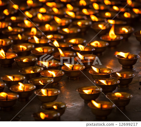 Burning candles in Buddhist temple, McLeod Ganj 12699217