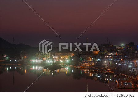 Sacred Puskhar lake (Sagar) and ghats of town Pushkar in twilig Sacred Puskhar lake (Sagar) and ghats of town Pushkar in twilig 12699462