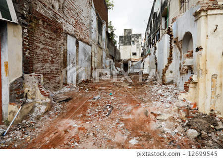 Street with ruins of demolished houses. Chennai, India Street with ruins of demolished houses. Chennai, India 12699545