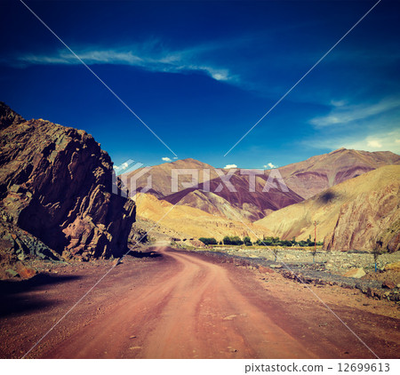 Road in Himalayas with mountains Road in Himalayas with mountains 12699613