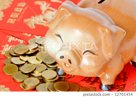 Piggy bank, red envelope called "Ang Pao" and gold coins. in Chinese new year concept 12701454