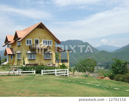 yellow house on the hill. 12702158