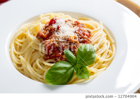 Spaghetti with Bolognese Sauce Parmesan and basil 12704904
