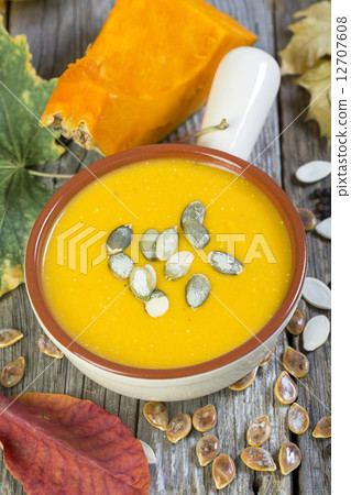 Bowl with traditional pumpkin soup. 12707608