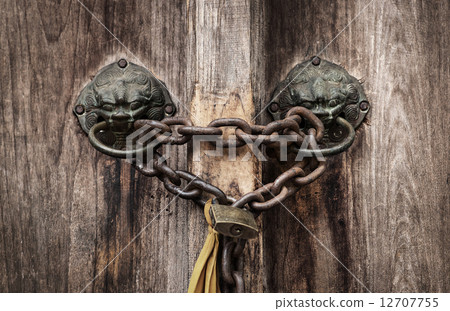 old rusted lock on a door 12707755