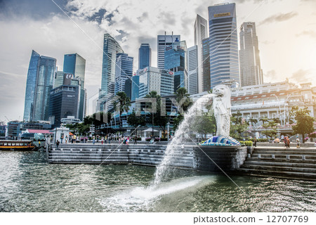 SINGAPORE-OCT 28: The Merlion fountain and Marina Bay Sand on OCT, 28, 2014. Merlion is an imaginary SINGAPORE-OCT 28: The Merlion fountain and Marina Bay Sand on OCT, 28, 2014. Merlion is an imaginary 12707769