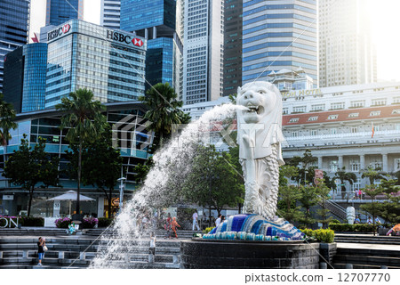 SINGAPORE-OCT 28: The Merlion fountain and Marina Bay Sand on OCT, 28, 2014. Merlion is an imaginary SINGAPORE-OCT 28: The Merlion fountain and Marina Bay Sand on OCT, 28, 2014. Merlion is an imaginary 12707770