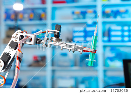 Robot holding a medical syringe 12708086