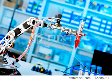 robot manipulates chemical tubes in the laboratory 12708087