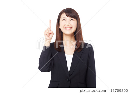 Pointing business woman 12709200