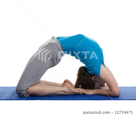Yoga - young beautiful woman doing yoga asana excerise isolated Yoga - young beautiful woman doing yoga asana excerise isolated 12710475