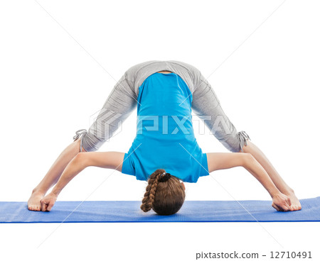 Yoga - young beautiful woman doing yoga asana excerise isolated Yoga - young beautiful woman doing yoga asana excerise isolated 12710491