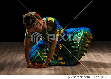 Beautiful girl dancer of Indian classical dance Bharatanatyam 12710516