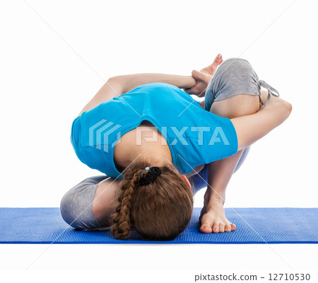 Yoga - young beautiful woman doing yoga asana excerise isolated Yoga - young beautiful woman doing yoga asana excerise isolated 12710530