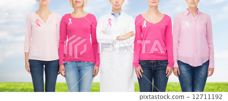 close up of women with cancer awareness ribbons 12711192