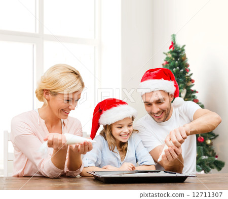 happy family in santa helper hats cooking happy family in santa helper hats cooking 12711307