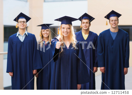group of smiling students in mortarboards 12711458
