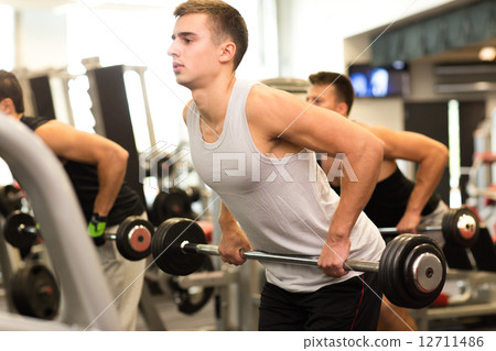 group of men with barbells in gym 12711486