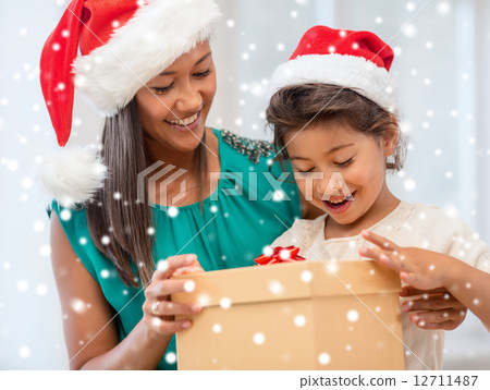 happy mother and child girl with gift box happy mother and child girl with gift box 12711487