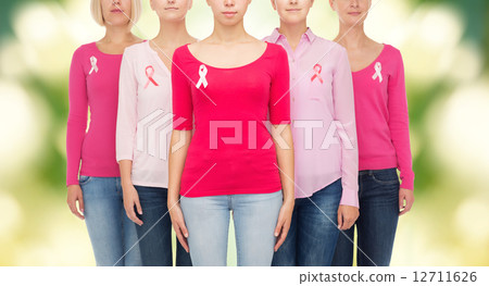close up of women with cancer awareness ribbons close up of women with cancer awareness ribbons 12711626