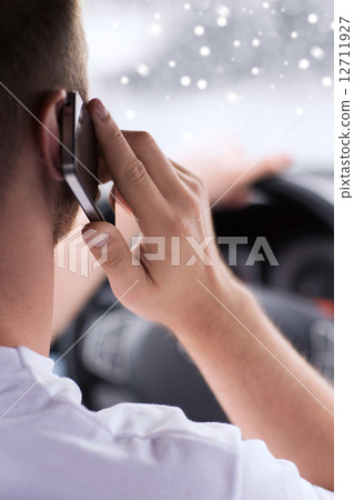close up of man using smartphone while driving car close up of man using smartphone while driving car 12711927