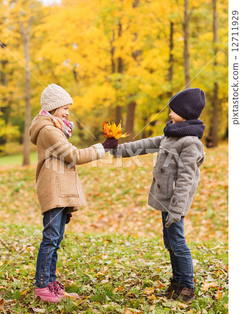 smiling children in autumn park smiling children in autumn park 12711929