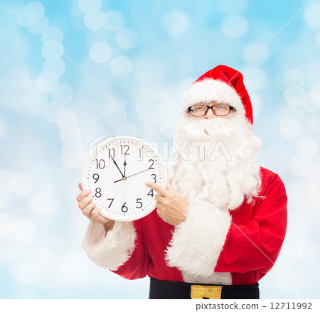man in costume of santa claus with clock man in costume of santa claus with clock 12711992