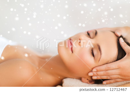 beautiful woman getting face or head massage 12712467