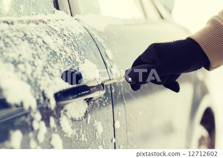 closeup of man hand opening car with key closeup of man hand opening car with key 12712602