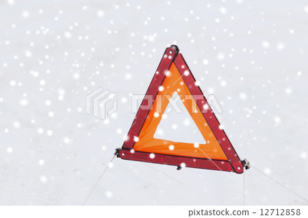 closeup of warning triangle on snow closeup of warning triangle on snow 12712858