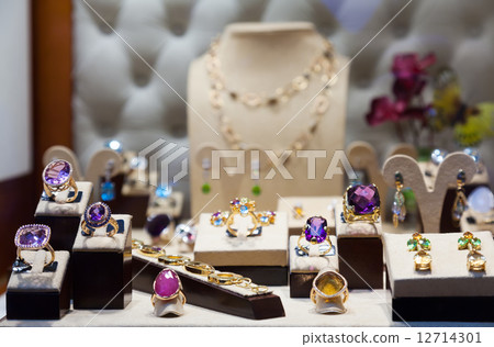 Golden jewelry with gems 12714301