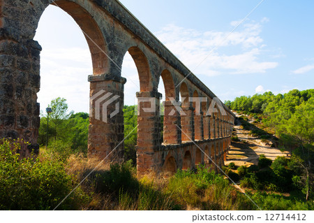 ancient aqueduct in sunny day. Tarragona ancient aqueduct in sunny day. Tarragona 12714412