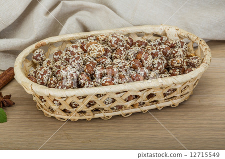 Peanut in honey with sesame seeds Peanut in honey with sesame seeds 12715549