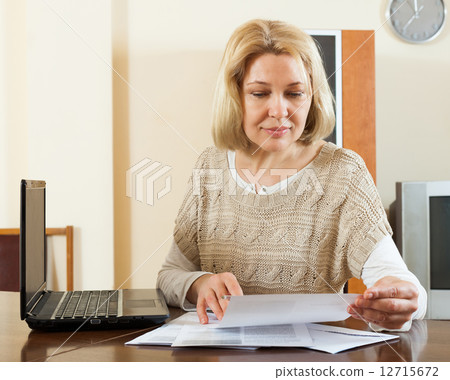 Blonde woman with documents Blonde woman with documents 12715672
