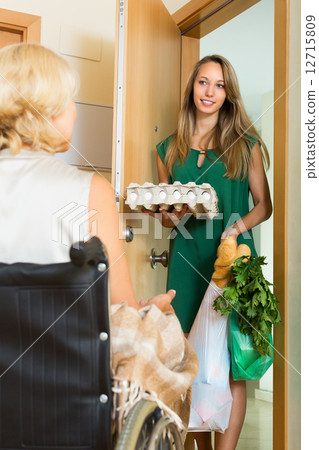 Female bringing food to invalid Female bringing food to invalid 12715809