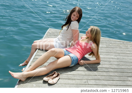 women on the berth at sunny vacation day women on the berth at sunny vacation day 12715965