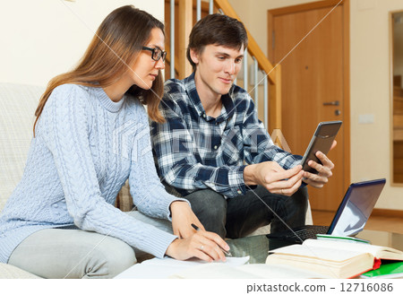 Couple student smiling and preparing for session 12716086
