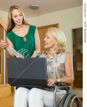 Happy woman in wheelchair 12716114