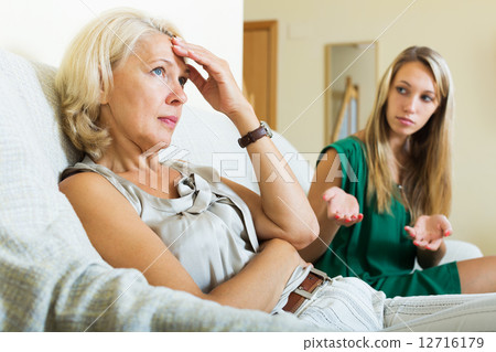 woman and mature mother having conflict 12716179