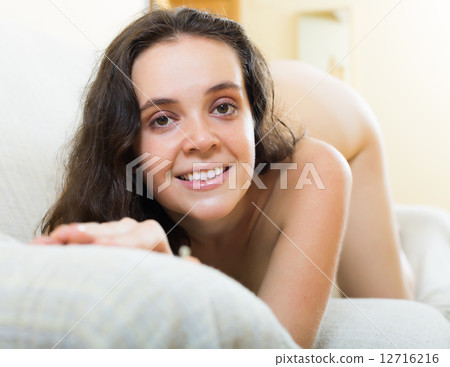 Sexy naked woman posing sofa 12716216